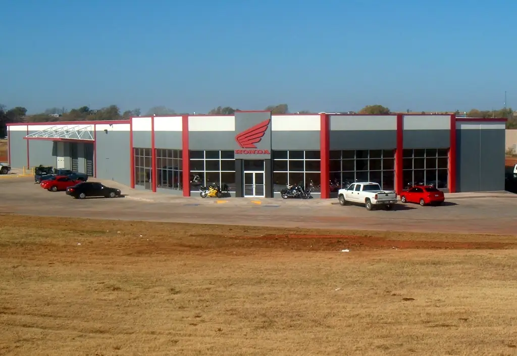 Elk City Honda dealership in Elk City, Oklahoma, red and gray metal with showroom glazing