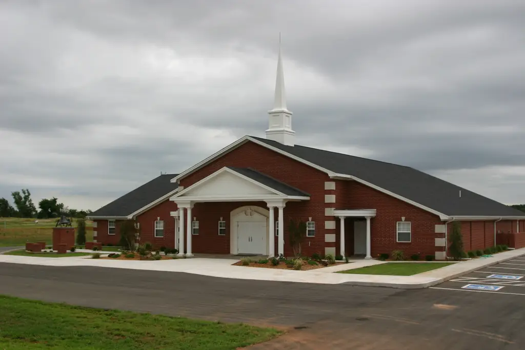First Christian Church in Hinton, Oklahoma, red brick with a white steeple, built by Sawatzky Construction