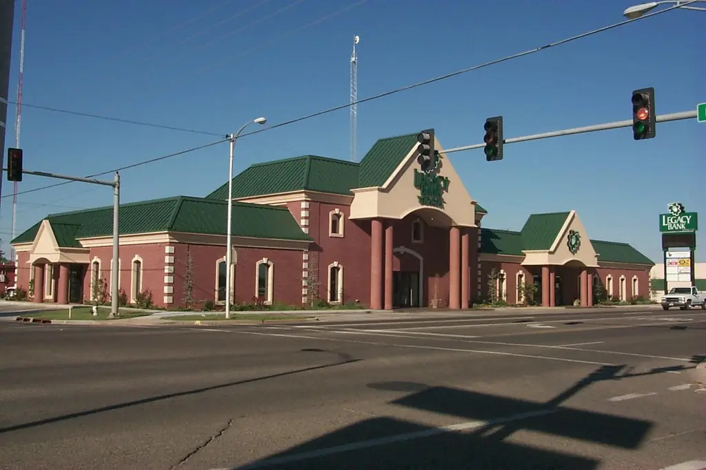 Legacy Bank in Weatherford, Oklahoma, brick with a green standing-seam roof, built by Sawatzky Construction